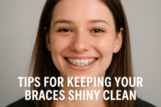 A girl with shiny braces smiling