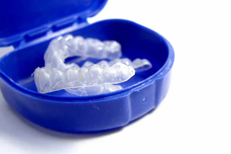 Orthodontic retainers in a blue case