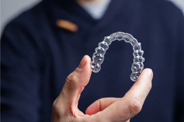 Man holding one transparent brace