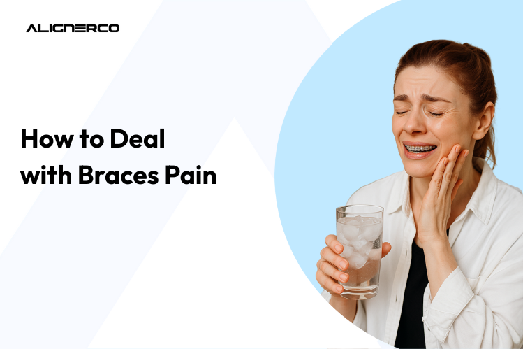 A woman suffering from braces pain while holding a glass full of ice water