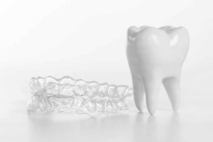 Clear aligners and miniature tooth