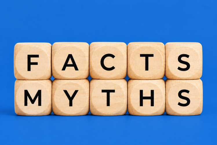 Wooden blocks spelling facts and myths on a blue background