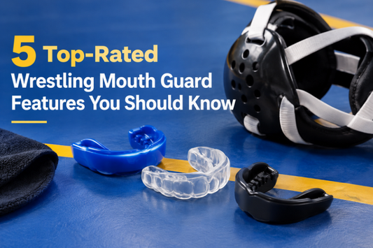 Wrestling headgear and mouth guards on a wrestling mat
