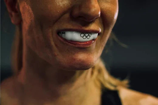 A Close-up Shot of a Woman Wearing Mouth Guard