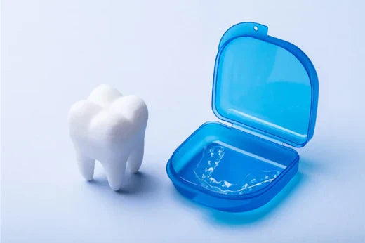   A dental model and a night guard in a case