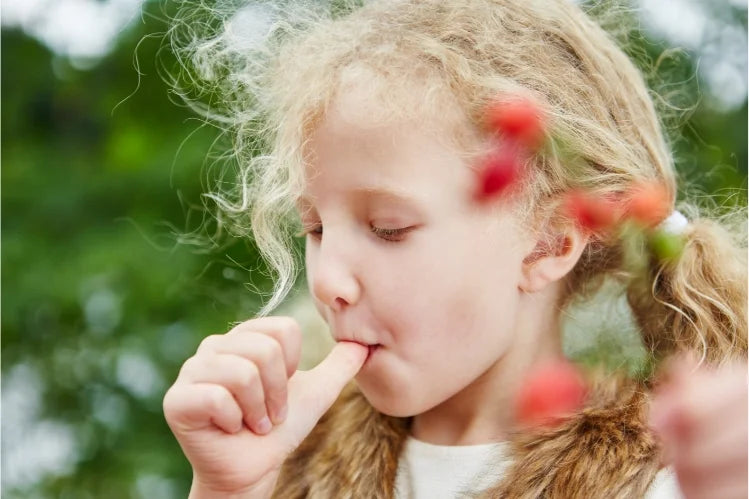 A girl sucking her thumb