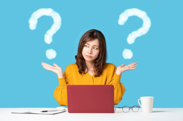 A woman choosing between metal retainers and clear retainers