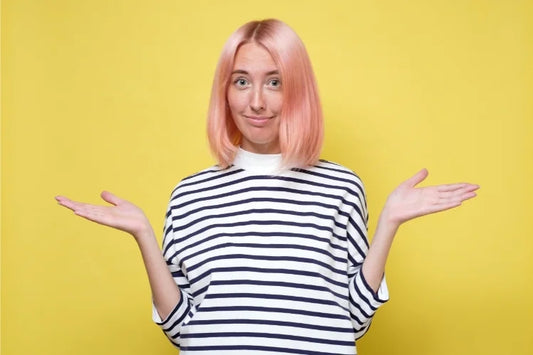 A woman with her hands out to compare Sisu Mouth Guard and ALIGNERCO mouth guard
