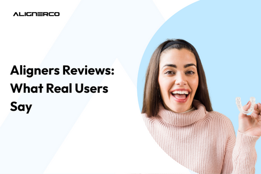 Young woman smiling with joy while holding clear aligners.