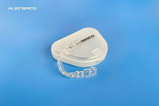 ALIGNERCO clear aligner case on a blue background