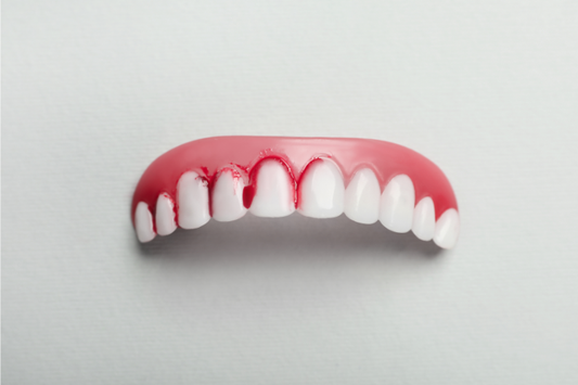 A dental model showing what bleeding dental gums look like