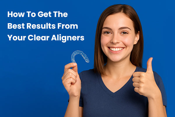 A girl doing a thumbs up with one hand and holding aligners in the other