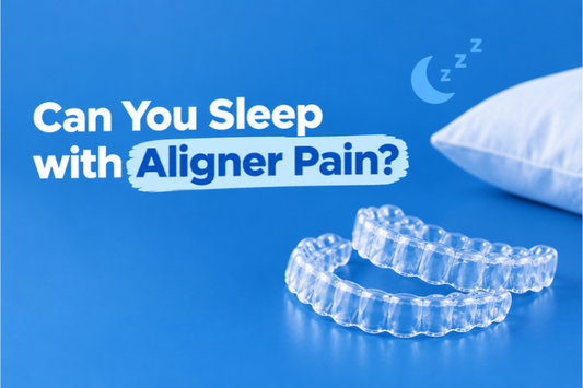 Clear aligners beside a pillow on a blue background about aligner pain