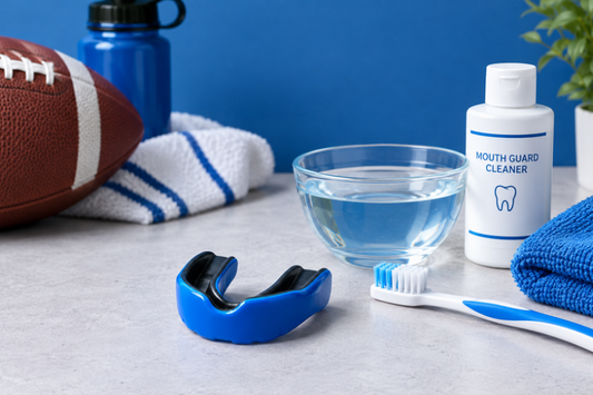 Blue sports mouth guard with a cleaning kit, toothbrush and football