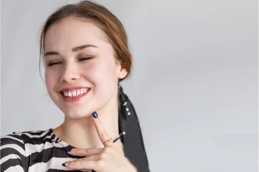 A beautiful woman shows her gapped teeth 