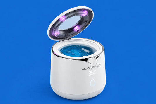 ALIGNERCO ultrasonic mouth guard cleaner with open lid on blue background