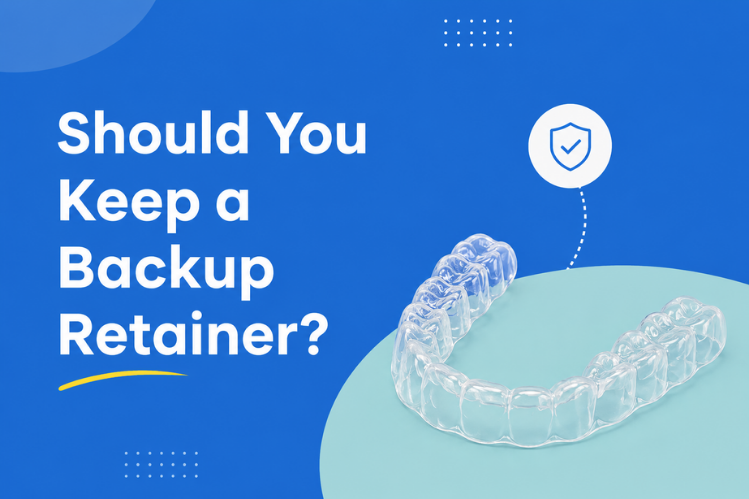 A clear orthodontic retainer on a clean background.