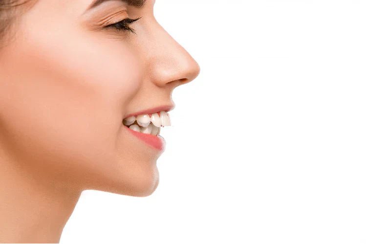 Side view of a woman with buck teeth.