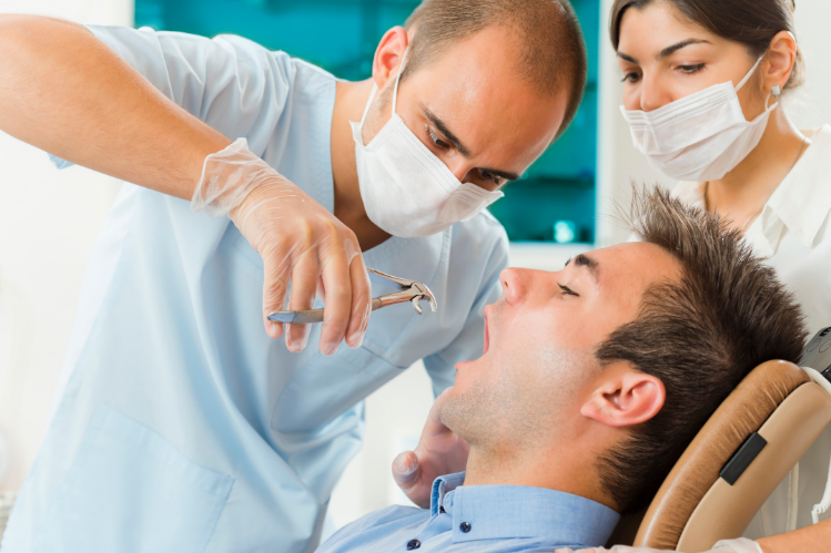 A man undergoing a tooth extraction.