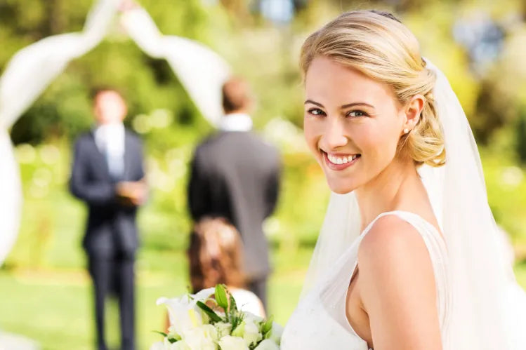  A bride confidently smiling on her big day.