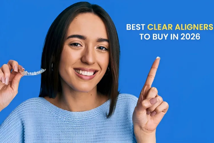 A girl holding clear aligners while smiling and pointing at the text “Best clear aligners to buy in 2026”.
