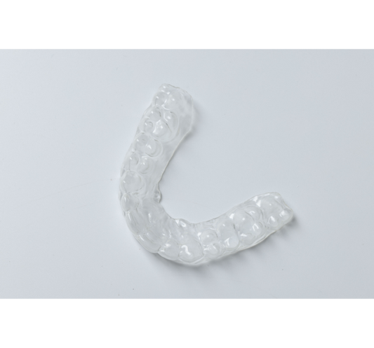  Clear braces on a grey background.