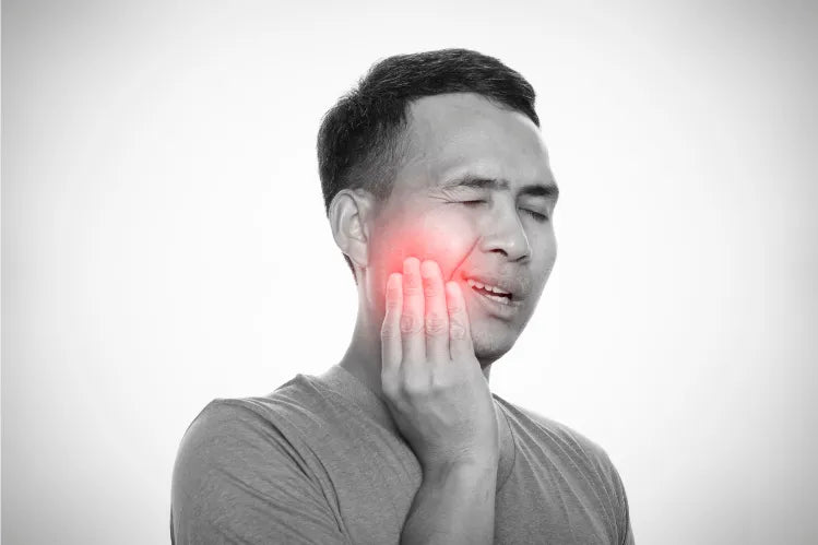  Man with jaw pain from grinding teeth at night.