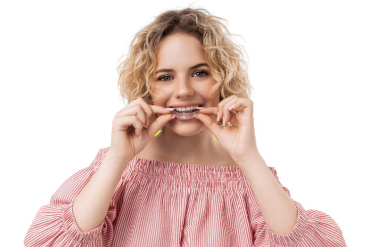 A woman about to wear clear aligners