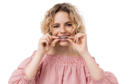 A woman about to wear clear aligners