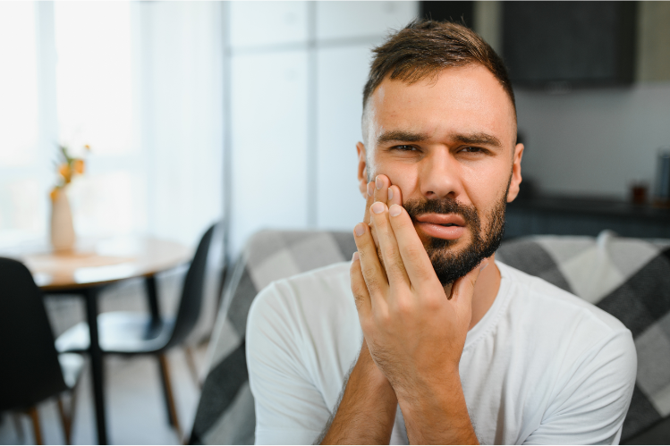 A man whose teeth hurt after wearing a night guard