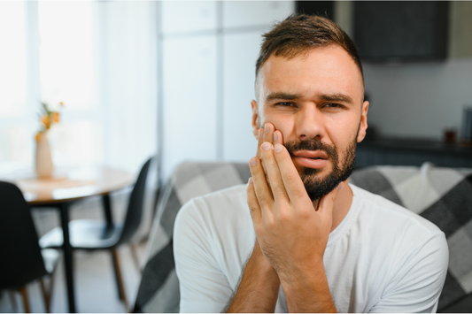 A man whose teeth hurt after wearing a night guard