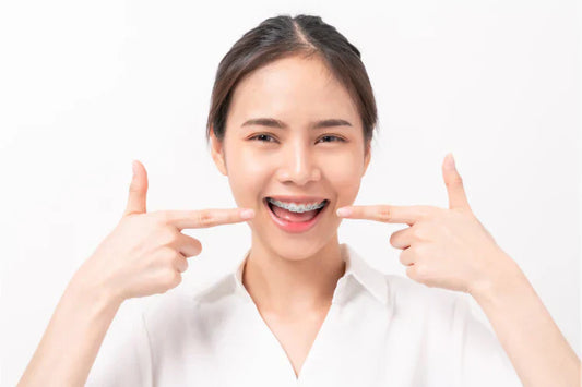 Woman is wearing traditional metal braces