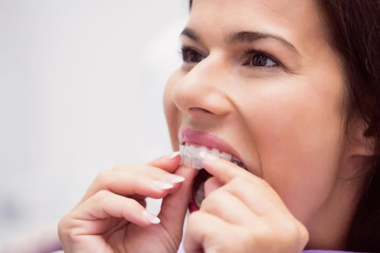 Woman wearing clear aligners for a straight smile