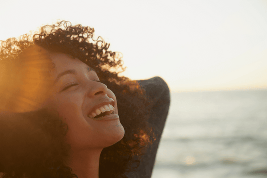A woman smiling outdoors