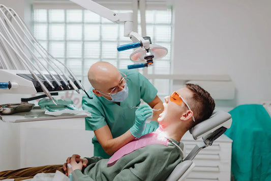 Dentist performing a procedure on a patient