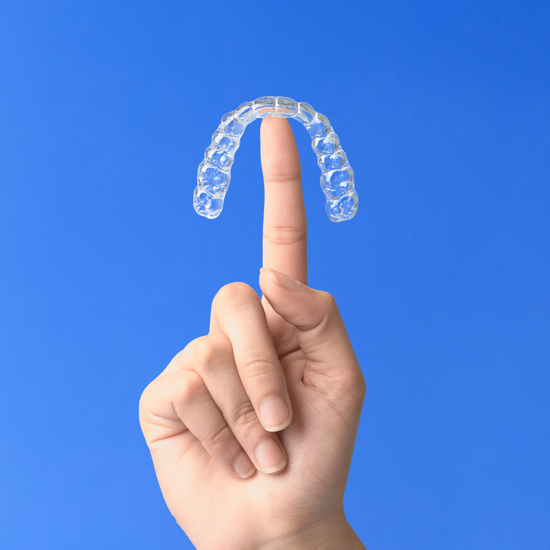   A dental model and a night guard in a case